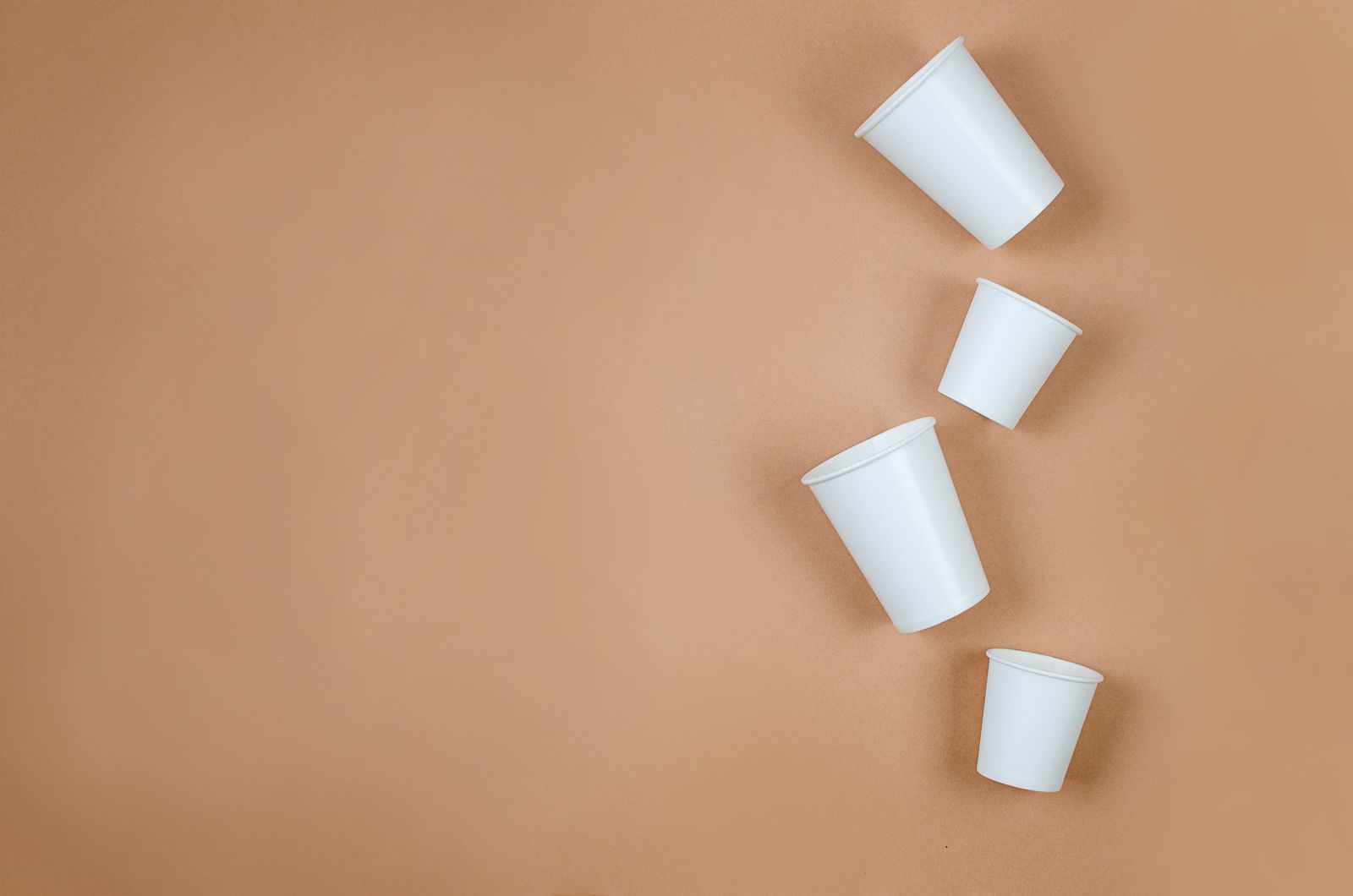 White paper cups on a kraft background